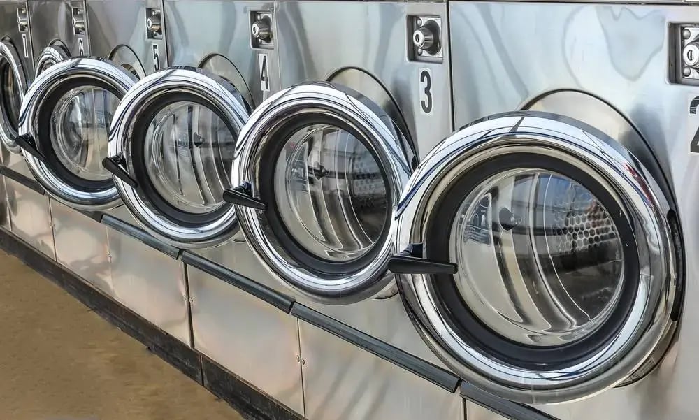 Multiple industrial laundry machines in commercial laundry